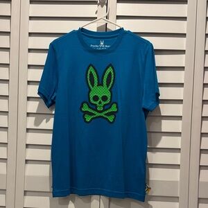 Psycho Bunny Jordan Mesh in Blue Clay Tee with Green Bunny Skull Graphic.